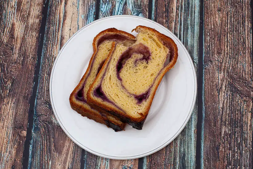 The crumb in this blueberry swirl sourdough brioche bread