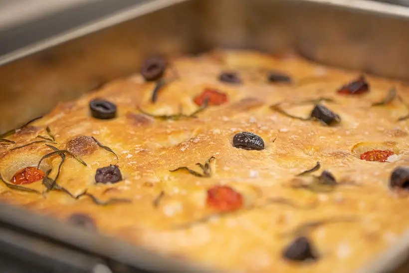 baked focaccia in a roasting pan