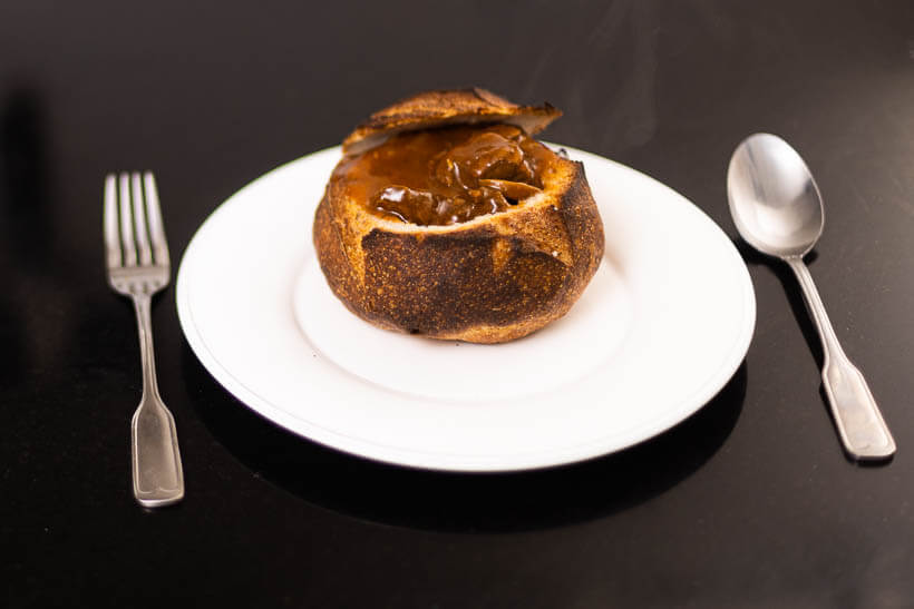 Hungarian goulash served in a sourdough bread bowl