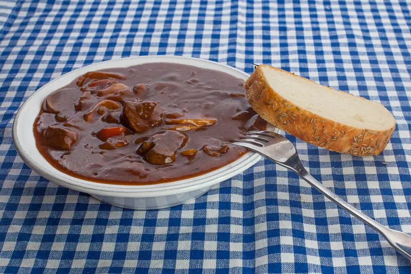 Hungarian goulash in a bowl with a piece of delicious bread!