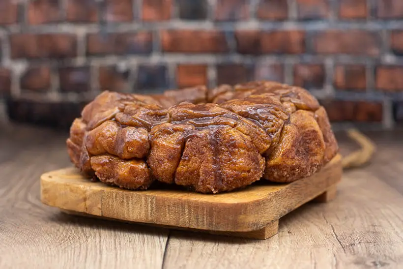 sourdough pull-apart monkey bread in front of a brick wall