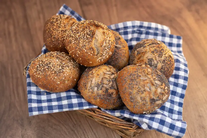 crusty sourdough rolls in a bread basket
