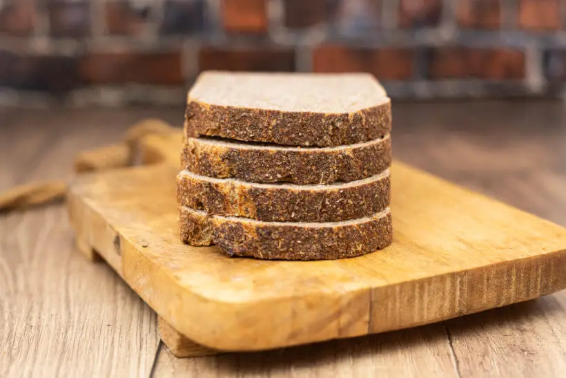 slices of whole-grain sourdough spelt bread on a board