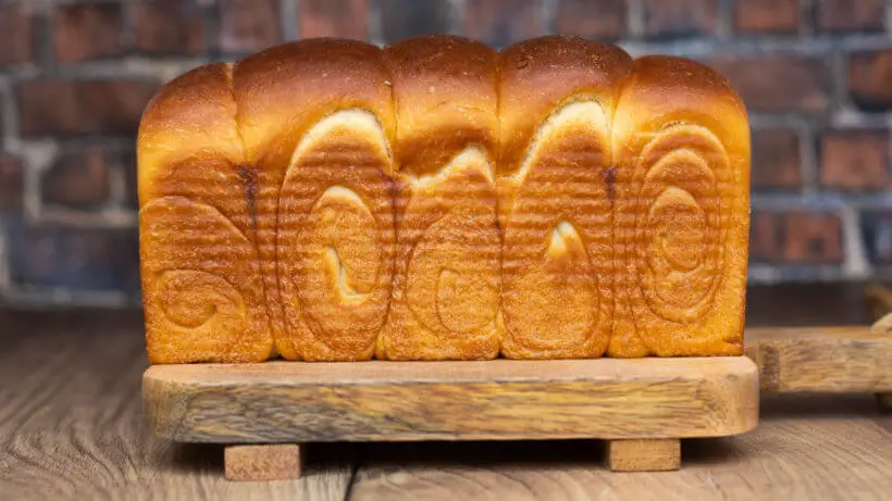 The swirls on the side of a Japanese milk bread showing off the shaping technique