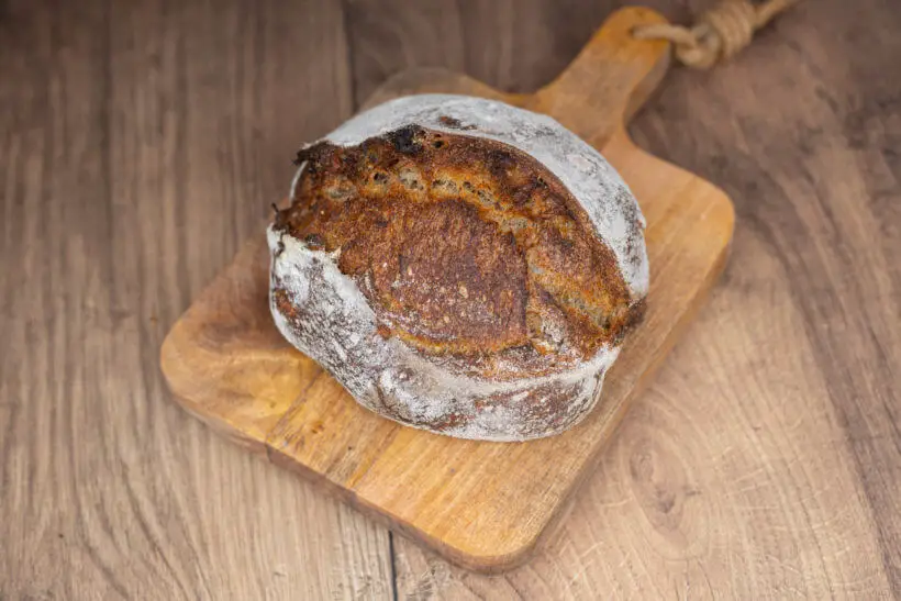 walnut sourdough bread on a wooden board
