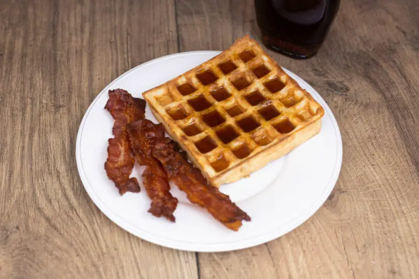 breakfast waffles with bacon and maple syrup