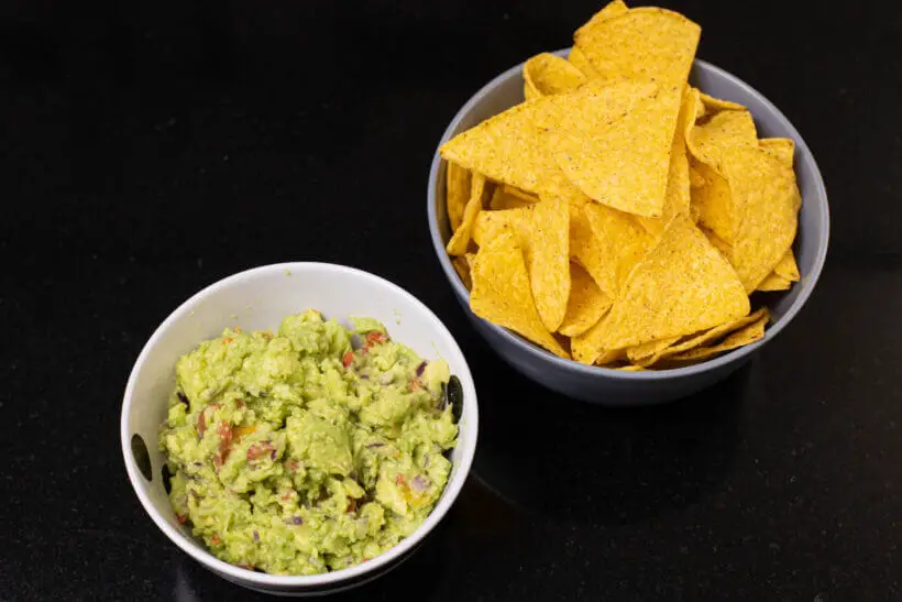 homemade guacamole with nacho chips