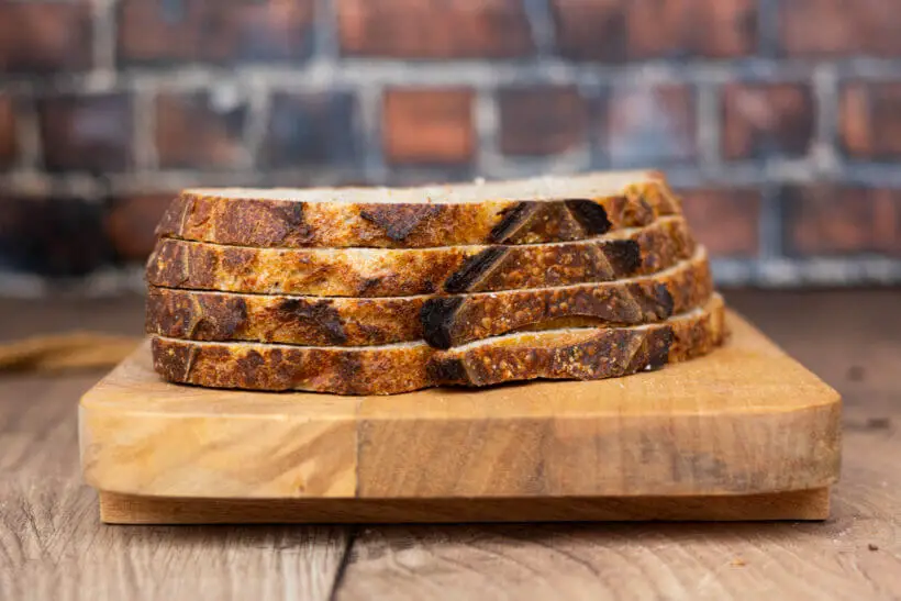 Four slices of einkorn sourdough bread on board