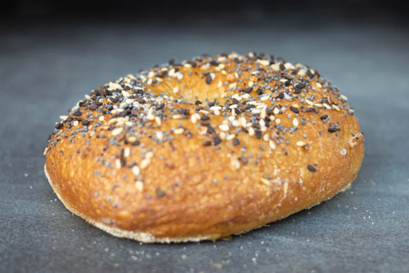 A bagel with everything bagel seasining