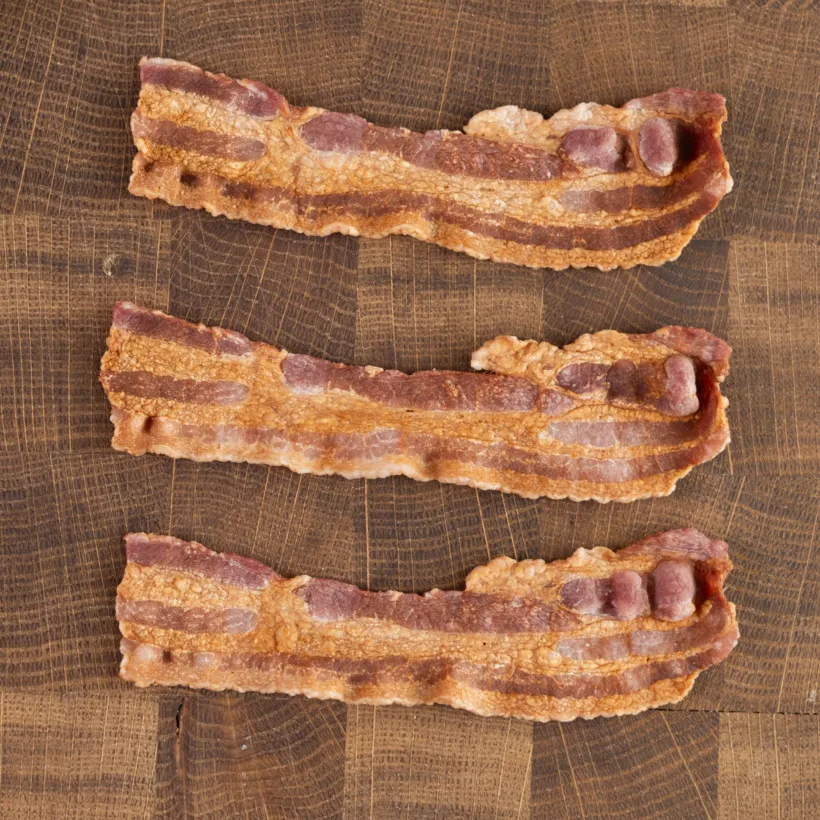 Thick strips of bacon cooked in the microwave